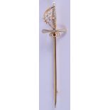 A GOLD AND ENAMEL SWORD BROOCH. 4.9 grams. 9 cm wide.