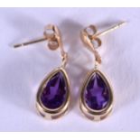 A PAIR OF GOLD AND AMETHYST EARRINGS. 1 grams. 0.7 cm long.