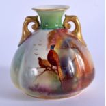 Royal Worcester two Handled vase painted with a brace of pheasants in a tree by Reginald Austin, sig
