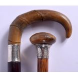 TWO 19TH CENTURY CONTINENTAL CARVED RHINOCEROS HORN HANDLED WALKING CANES. Largest 88 cm long. (2)