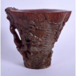A CHINESE CARVED BUFFALO HORN TYPE LIBATION CUP 20th Century. 14 cm x 11 cm.