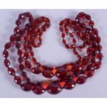 A NEAR PAIR OF VINTAGE RED CRYSTAL BEAD NECKLACES. 72 cm long.