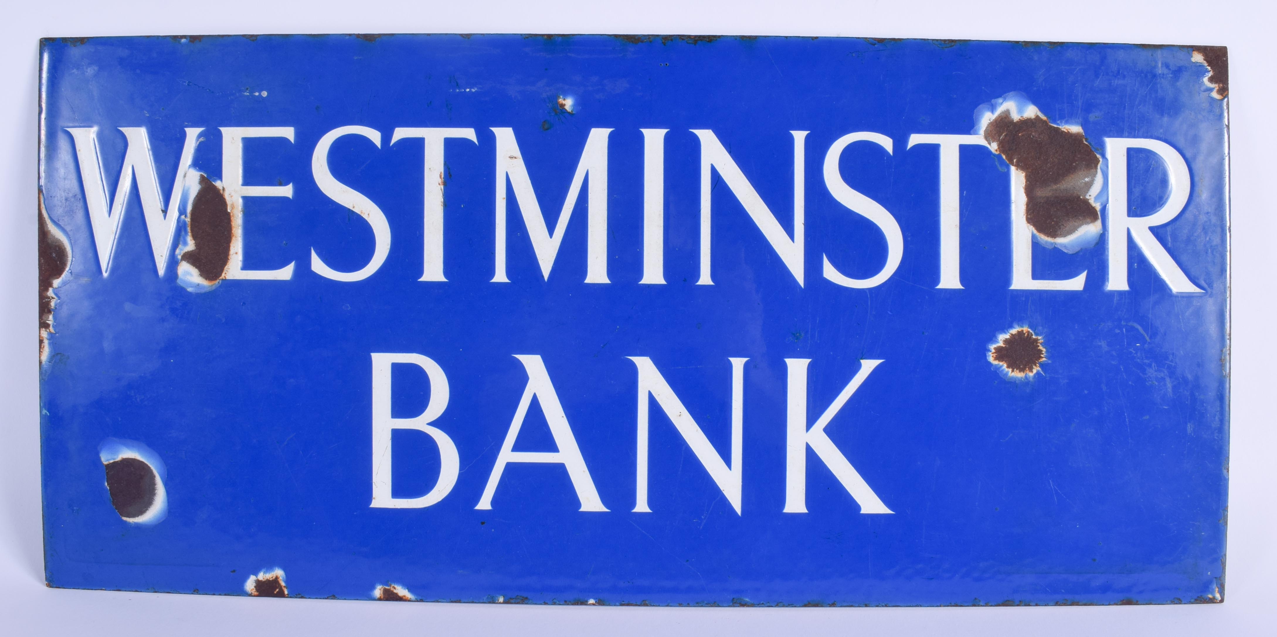 A BLUE ENAMEL WESTMINSTER BANK SIGN. 50 cm x 24 cm.