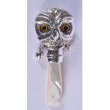 A SILVER OWL BABIES RATTLE. 8 cm long.