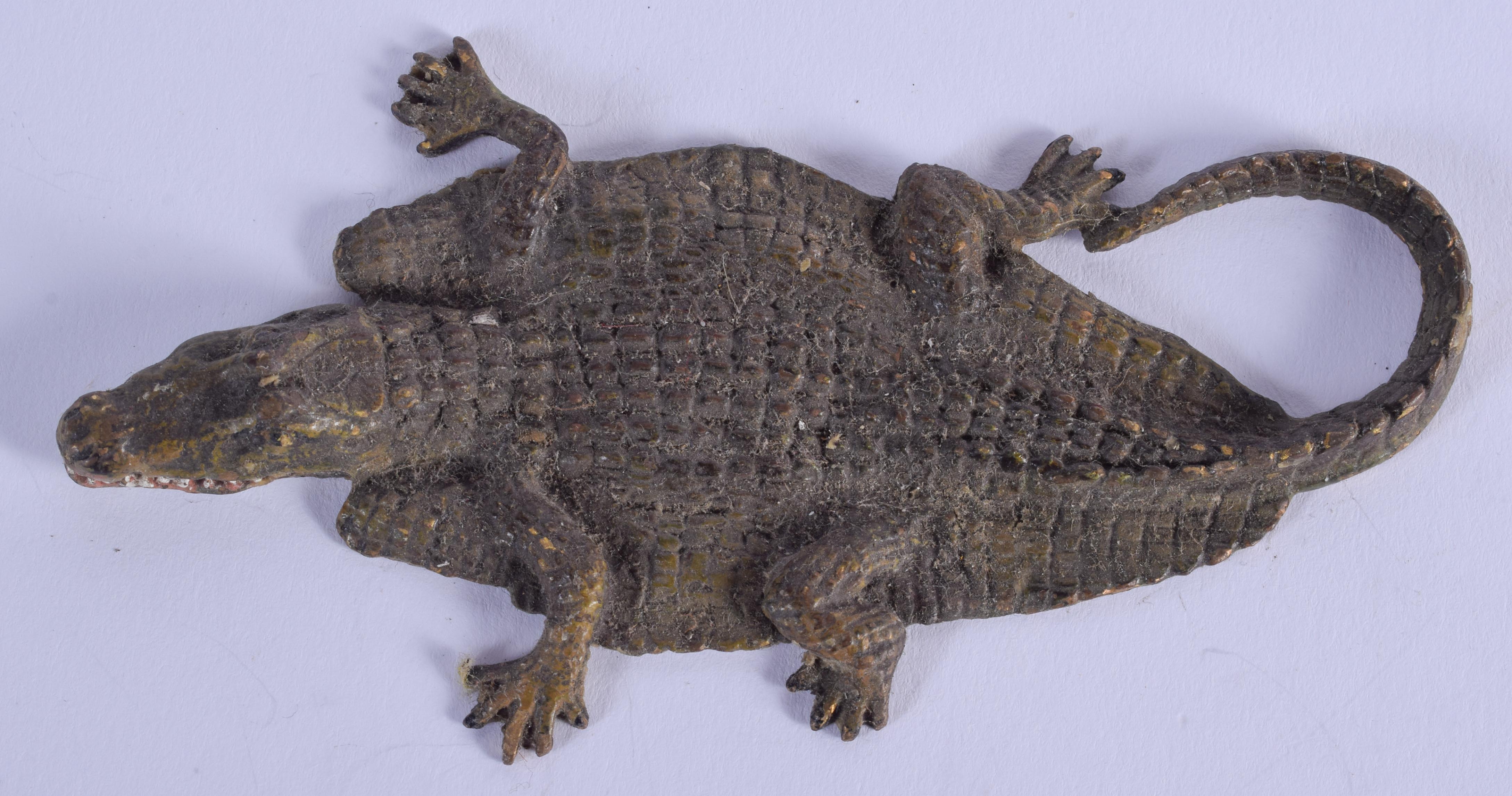 A COLD PAINTED BRONZE CROCODILE RUG. 12 cm x 4 cm.