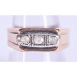 A VINTAGE GOLD AND DIAMOND STUD RING. 3.8 grams. O.