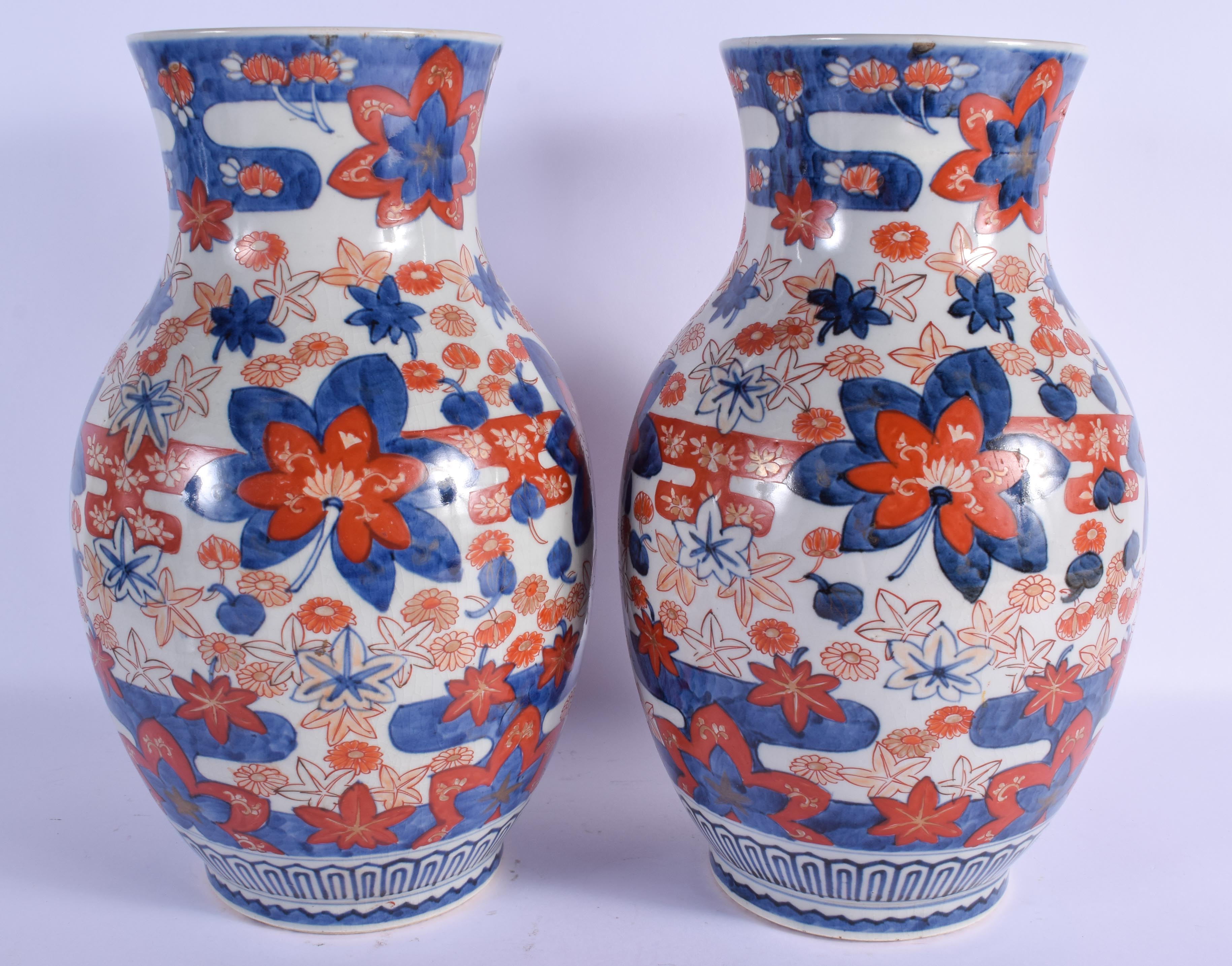 A LARGE PAIR OF 19TH CENTURY JAPANESE MEIJI PERIOD IMARI VASES painted with flowers. 37 cm x 15 cm. - Image 2 of 3