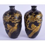 A PAIR OF CHINESE BRONZE VASES 20th Century, decorated with birds amongst foliage. 21 cm high.