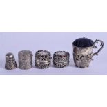 A VERY UNUSUAL ANTIQUE SILVER MUG PIN CUSHION together with three silver boxes & a silver thimble. 8
