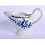 18th c. Liverpool moulded butterboat painted in under-glaze blue with a trailing flower on each side