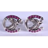 A PAIR OF SILVER RUBY HORSE HEAD CUFFLINKS. 2 cm wide.