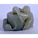 AN EARLY 20TH CENTURY CHINESE CARVED GREEN JADE FIGURE OF A BOY modelled holding a drum. 5 cm x 3.25