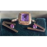 A VINTAGE GOLD AND AMETHYST RING with matching earrings. 4 grams. Ring V/W. (3)
