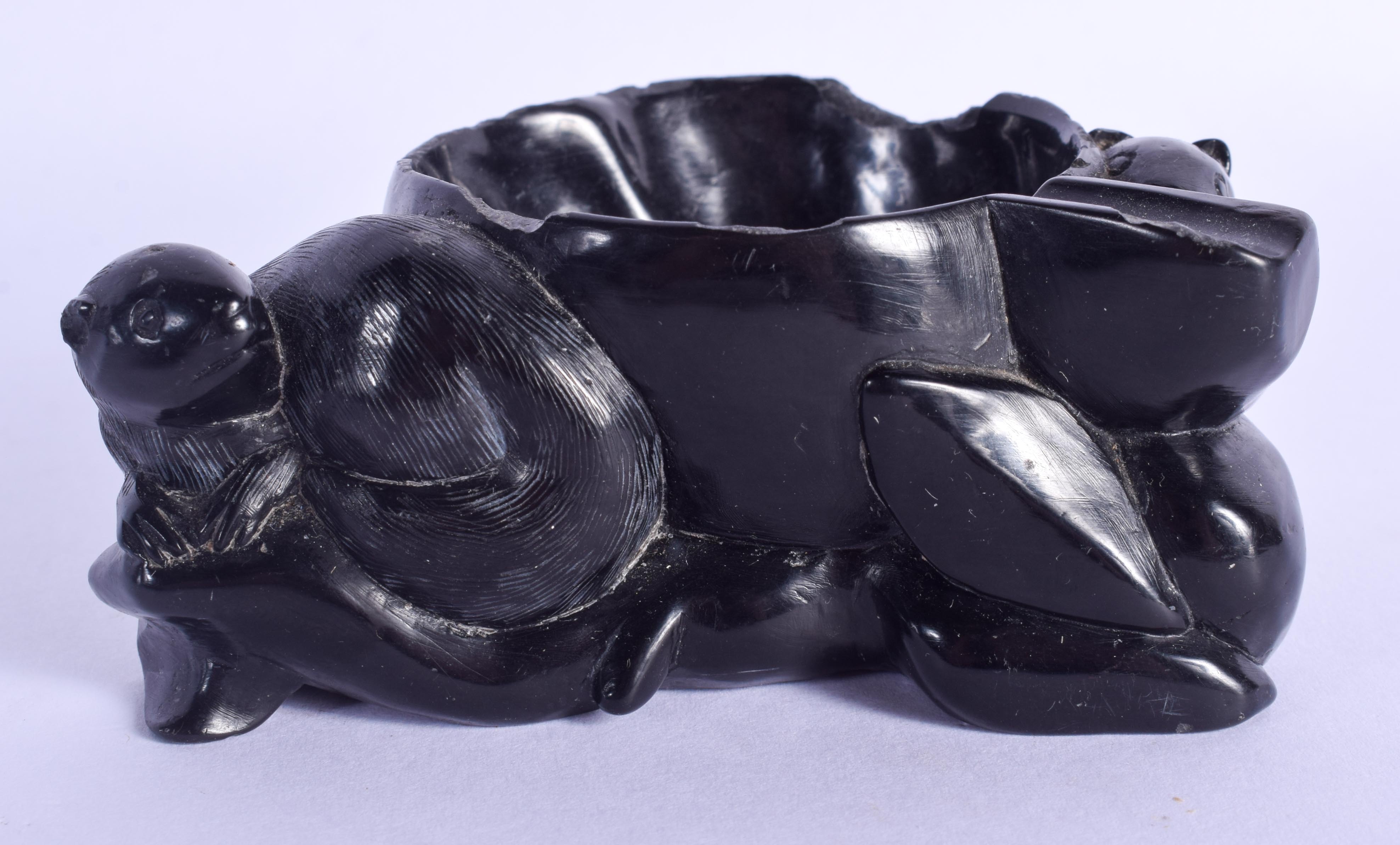 AN EARLY 20TH CENTURY CHINESE CARVED BLACK STONE BRUSH WASHER. 9 cm x 6 cm.