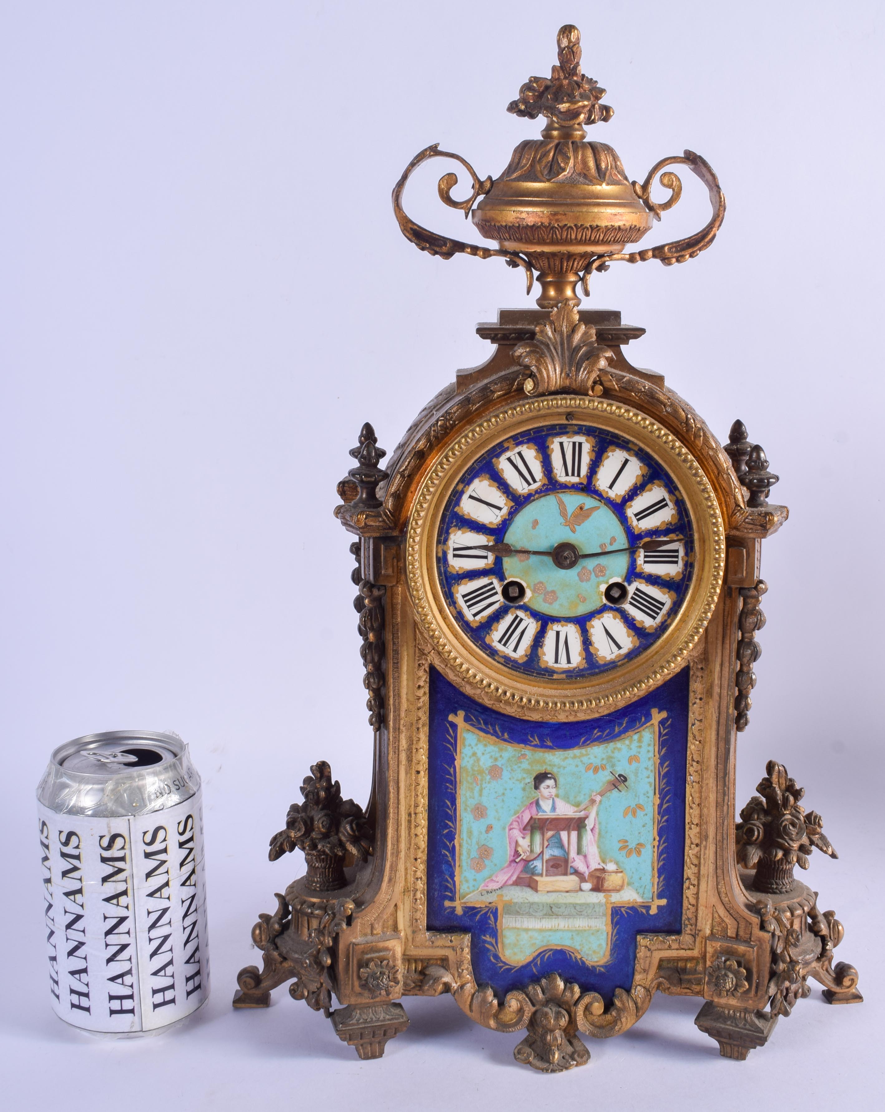 A 19TH CENTURY FRENCH ORMOLU SEVRES PORCELAIN MANTEL CLOCK painted with flowers. 37 cm x 11 cm.