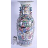 A VERY LARGE 19TH CENTURY CHINESE FAMILLE ROSE PORCELAIN CANTON VASE Qing, decorated with figures an
