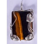 A SILVER AND TIGERS EYE PENDANT. 5.5 cm x 3.5 cm.