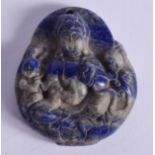 A CHINESE CARVED GUANYIN BUDDHISTIC LAPIS LAZULI PENDANT. 4 cm x 4.25 cm.