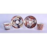 Royal Crown Derby two coffee cans and saucers painted with an imari pattern. Saucer 14cm diameter,