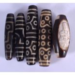 FIVE CHINESE TIBETAN AGATE ZHU BEADS 20th Century. Largest 8 cm long. (5)