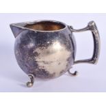 AN ARTS AND CRAFTS CHRISTOPHER DRESSER SILVER PLATED CREAM JUG. 109 grams. 8 cm wide.