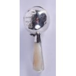 AN ANTIQUE SILVER AND MOTHER OF PEARL BABIES RATTLE. 8 cm long.