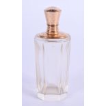 AN ANTIQUE 18CT GOLD MOUNTED CRYSTAL GLASS SCENT BOTTLE. 9 cm high.