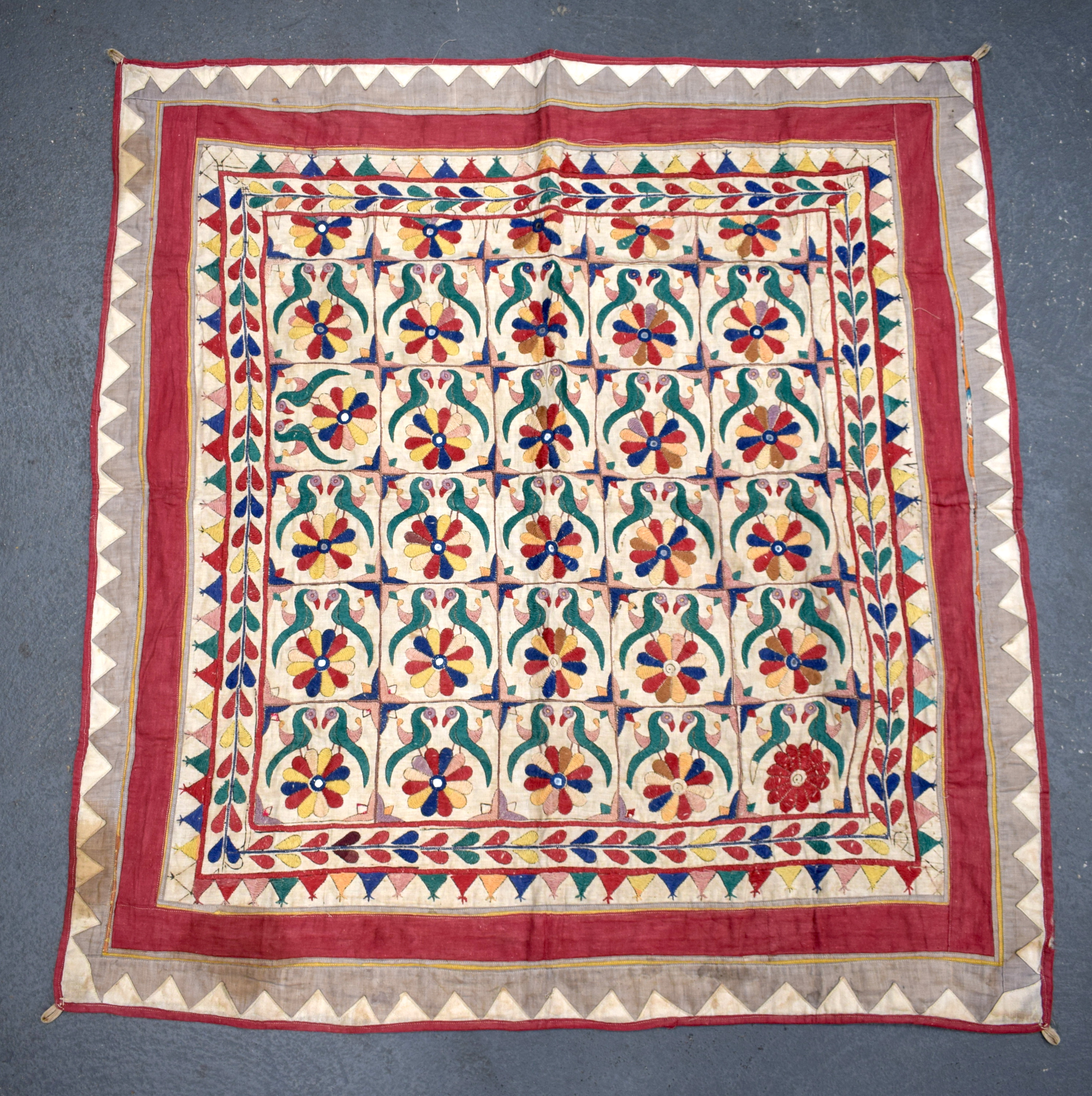 A MIDDLE EASTERN INDIAN EMBROIDERED TEXTILE. 98 cm x 96 cm.