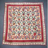 A MIDDLE EASTERN INDIAN EMBROIDERED TEXTILE. 98 cm x 96 cm.