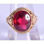 A VINTAGE GOLD AND RUBY RING. 7.8 grams. Ruby 1 cm x 1.5 cm.