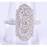 A CHARMING ART DECO PLATINUM AND DIAMOND RING the three central stones of approx 0.7 cts, encased wi