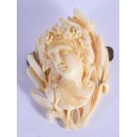A FINE 19TH CENTURY EUROPEAN CARVED IVORY BROOCH formed as a classical maiden. 4 cm x 5.5 cm.