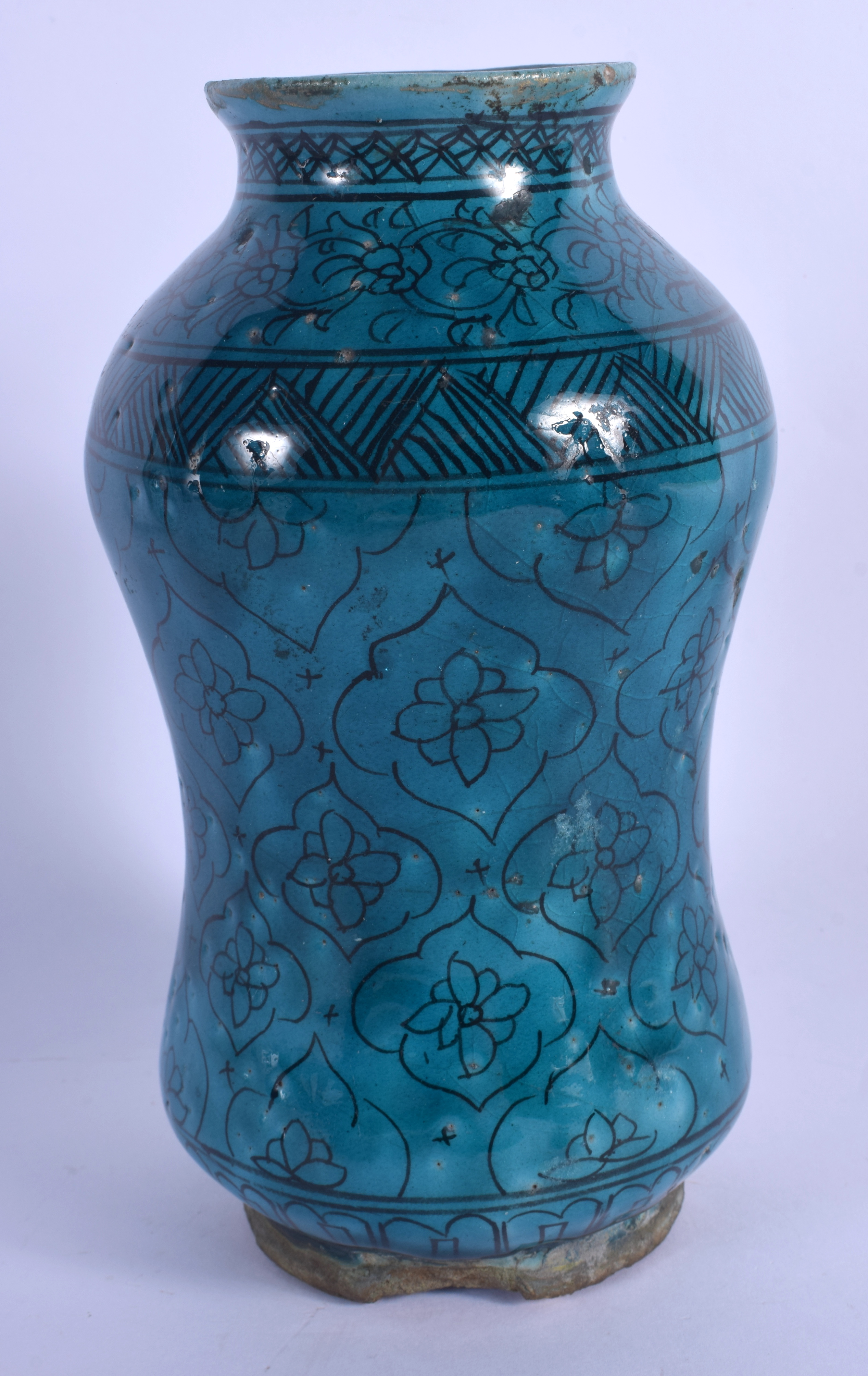 AN EARLY MIDDLE EASTERN KASHAN ISLAMIC TURQUOISE GLAZED ALBARELLO JAR painted with flowers. 21.5 cm