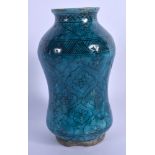 AN EARLY MIDDLE EASTERN KASHAN ISLAMIC TURQUOISE GLAZED ALBARELLO JAR painted with flowers. 21.5 cm