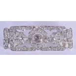 A FINE ART DECO PLATINUM AND DIAMOND BROOCH the central stone of approximately 0.5 ct, each side sto