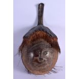 AN UNUSUAL 19TH CENTURY COCONUT BUGBEAR STORAGE CONTAINER. 20 cm x 11 cm.