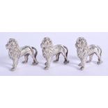 THREE VINTAGE WHITE METAL LIONS. 102 grams. 3 cm x 3 cm. (3)