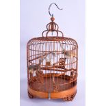A CHINESE REPUBLICAN PERIOD BAMBOO BIRD CAGE with porcelain feeders. 35 cm x 18 cm.