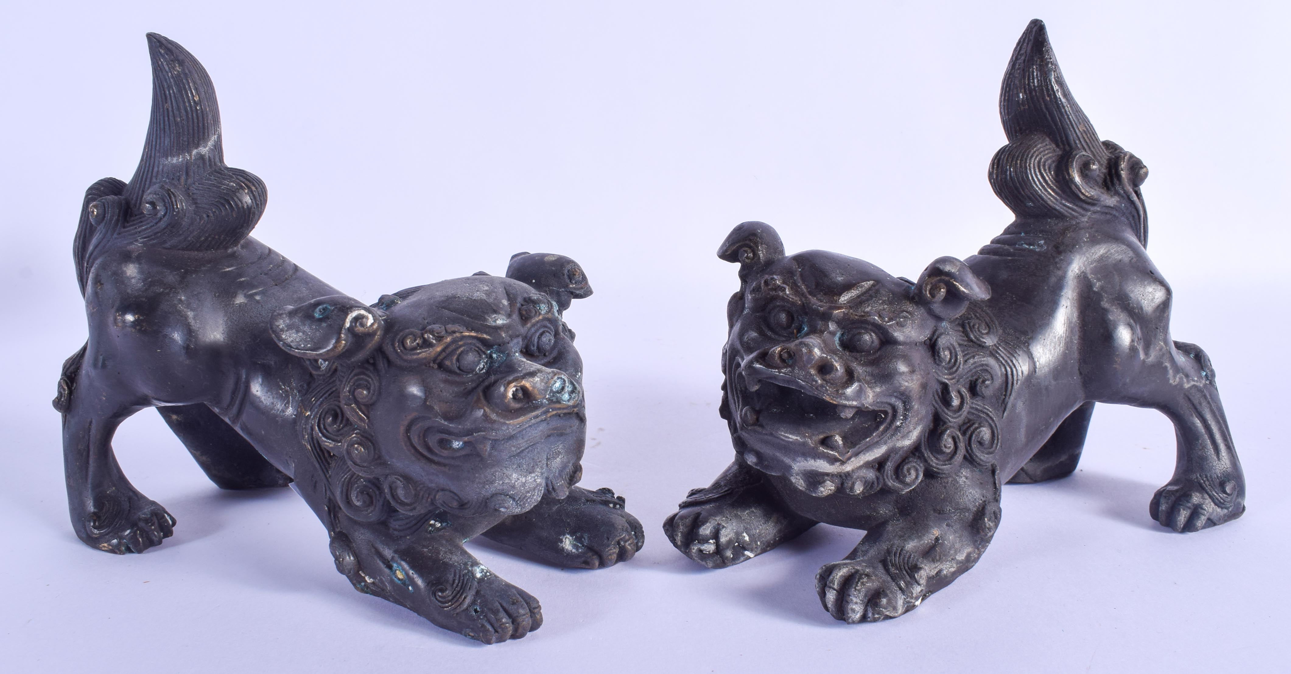 A PAIR OF CHINESE BRONZE BUDDHISTIC DOGS OF FOE 20th Century. 16 cm x 11 cm.
