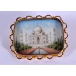 A GOLD AND IVORY MIDDLE EASTERN IVORY TAJ MAHAL BROOCH. 6.6 grams. 3 cm x 2.5 cm.