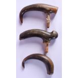 THREE 19TH CENTURY CARVED CONTINENTAL CARVED RHINOCEROS HORN WALKING CANE HANDLES. Largest 11 cm