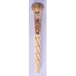 AN ANTIQUE 9CT GOLD AND IVORY CANE HANDLE. 16.5 cm long.
