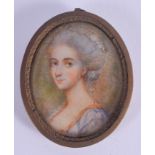 AN ANTIQUE PAINTED IVORY PORTRAIT MINIATURE. Image 3 cm x 3.5 cm.