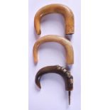 THREE 19TH CENTURY CARVED CONTINENTAL CARVED RHINOCEROS HORN WALKING CANE HANDLES. Largest 11 cm