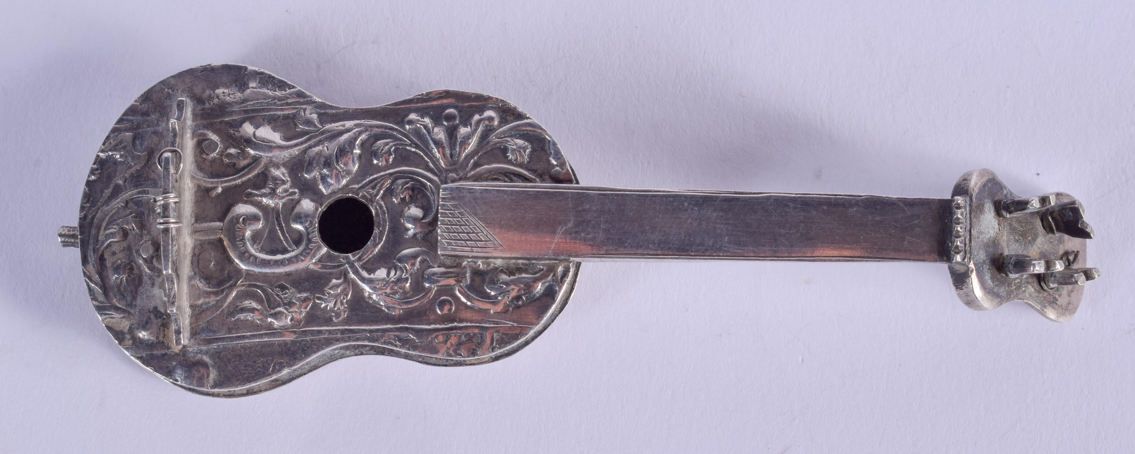 AN ANTIQUE CONTINENTAL SILVER GUITAR. 33 grams. 9 cm long.