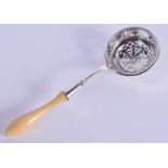 AN ANTIQUE CONTINENTAL BONE AND SILVER SIFTING SPOON. 17 cm long.