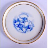 Minton plaque painted with cherubs in blue, impressed mark. 19Cm wide