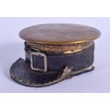 A RARE ANTIQUE MILITARY BRASS HAT INKWELL. 6 cm x 4 cm.