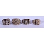 FOUR CHINESE WHITE METAL RINGS. (4)