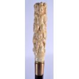 A NOVELTY BONE HANDLED CARVED WOOD WALKING CANE. 84 cm long.